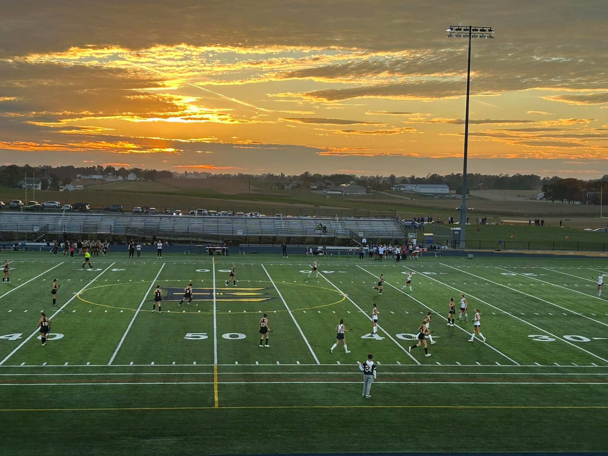 field hockey next to farm fields